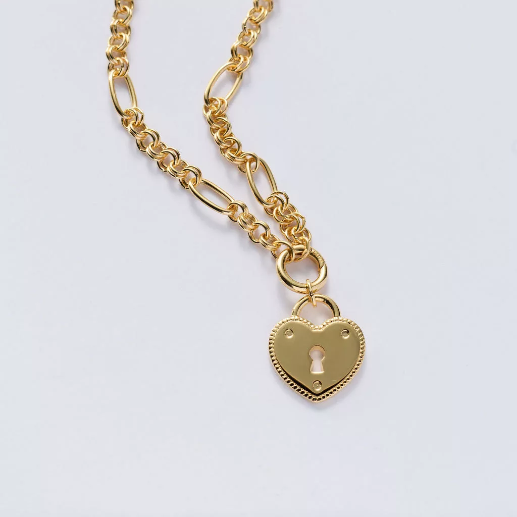 &LIVY Locked Into Love Heart Expandable Necklace in finely finished gold featuring heart-shaped lock pendant with keyhole design and beaded edge detail on expandable gold chain with mixed link styles