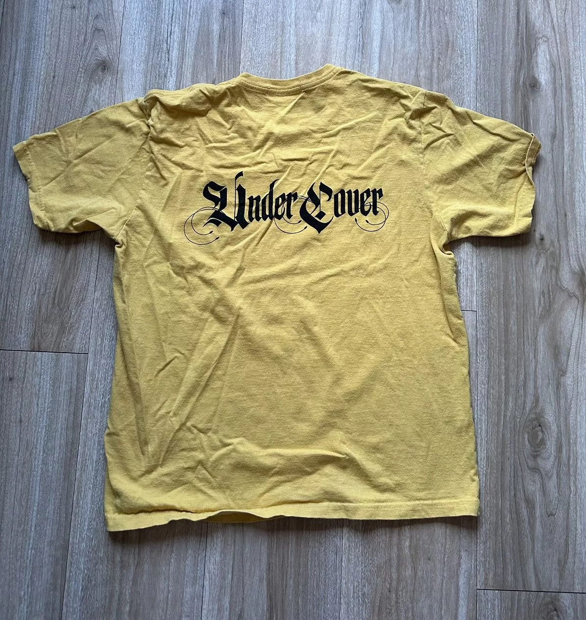 Undercover Short Sleeve T Shirts Undercover Yellow Gothic Text Tee