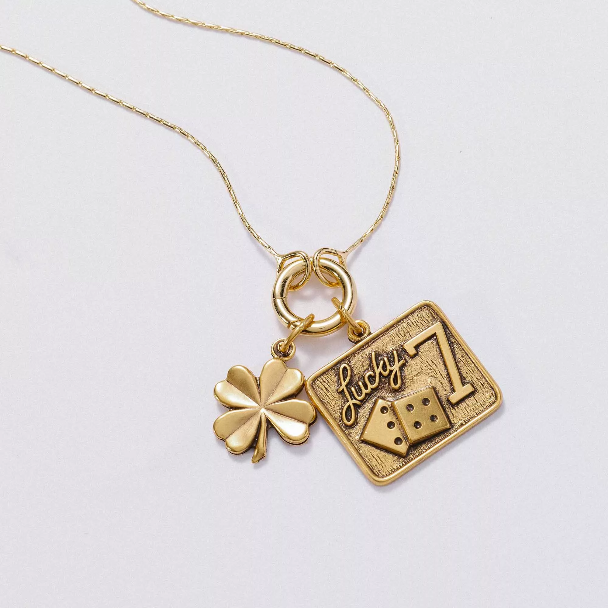 &LIVY Take a Chance Expandable Necklace Set in gold featuring Lucky 7 dice charm and four-leaf clover charm on expandable chain