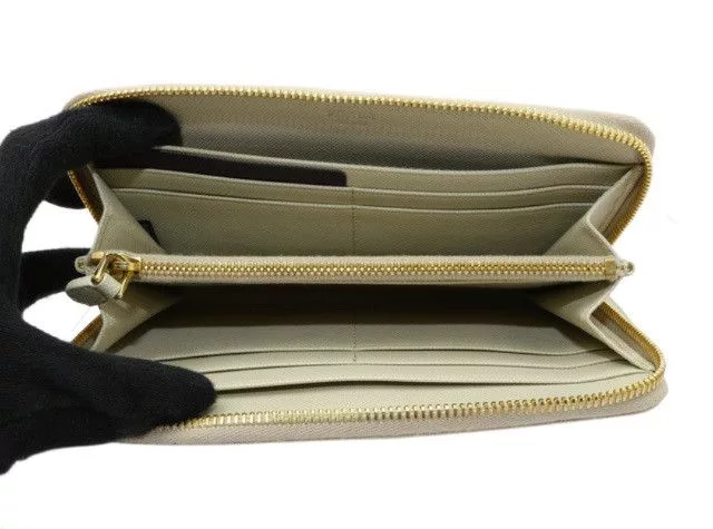Prada Wallets Prada Saffiano Leather Zippy White Wallet