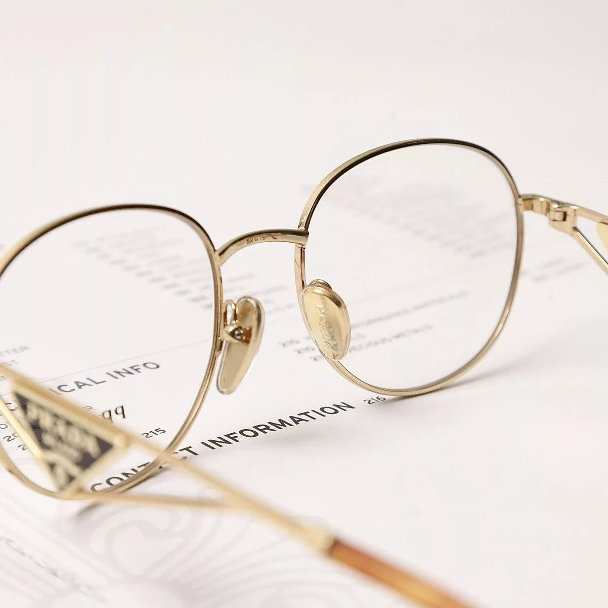 Prada Glasses PRADA 0PR A50V GLASSES Gold