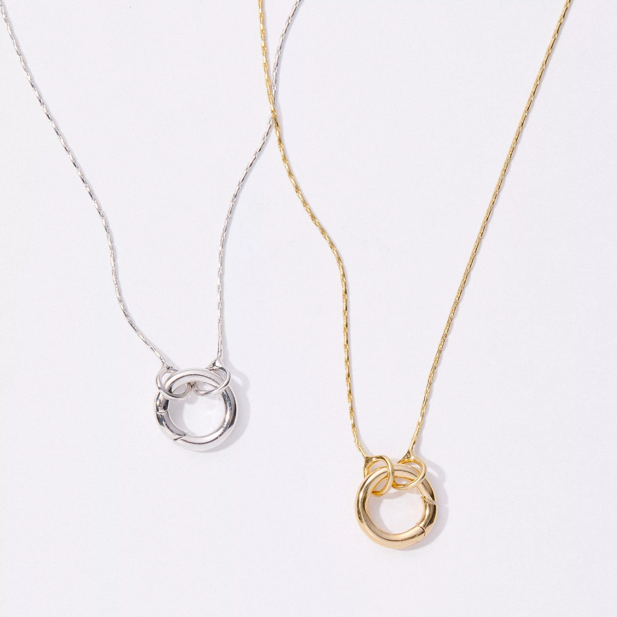 &LIVY Expandable Intention Chain Charm Necklace in both finely finished silver and finely finished gold showing signature interlocking ring clasp detail on delicate chains