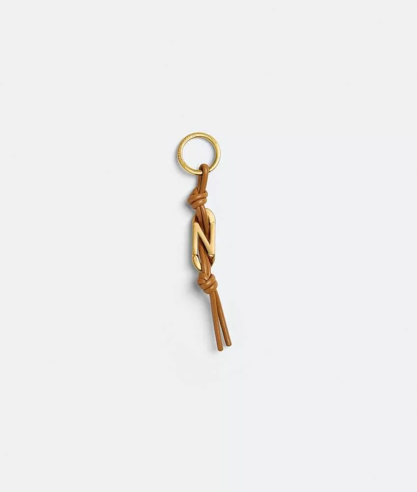 Bottega Veneta Rings Bottega Veneta o1n1vont0624 Size: OS / Alphabet Keyring in Gold/Brown Multi