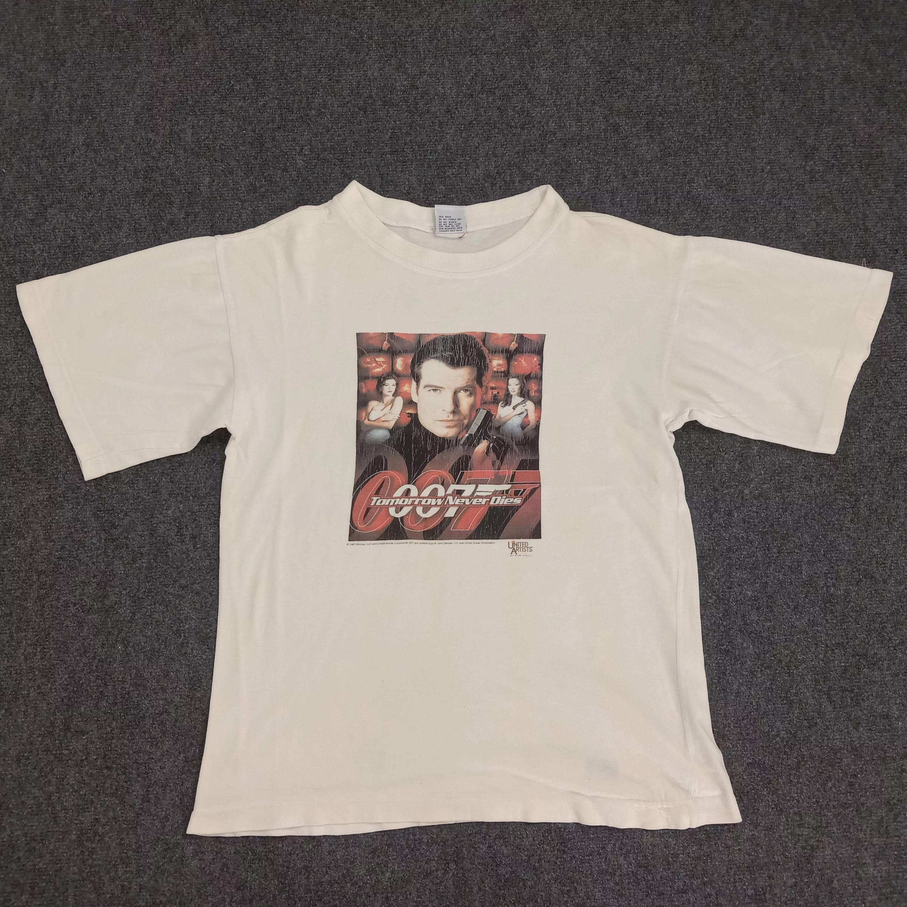Universal Studios Short Sleeve T Shirts Universal Studios × Vintage James Bond 007 Tomorrow Never Dies Movie Tshirt White