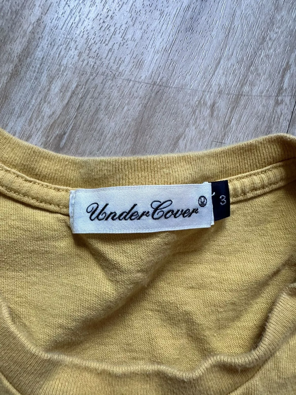 Undercover Short Sleeve T Shirts Undercover Yellow Gothic Text Tee