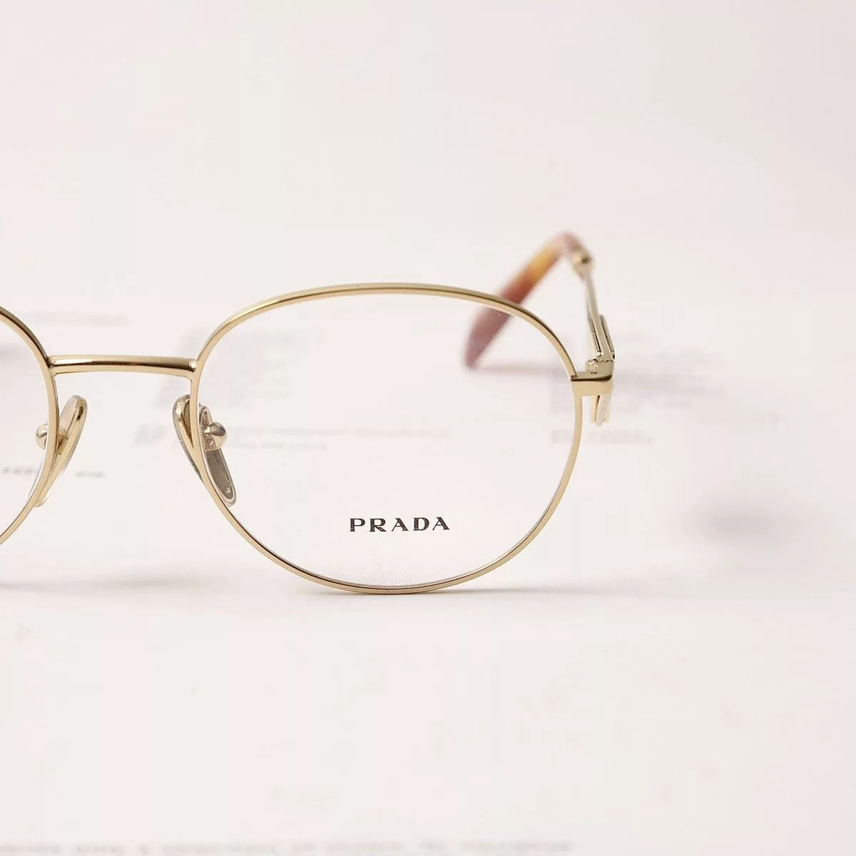 Prada Glasses PRADA 0PR A50V GLASSES Gold