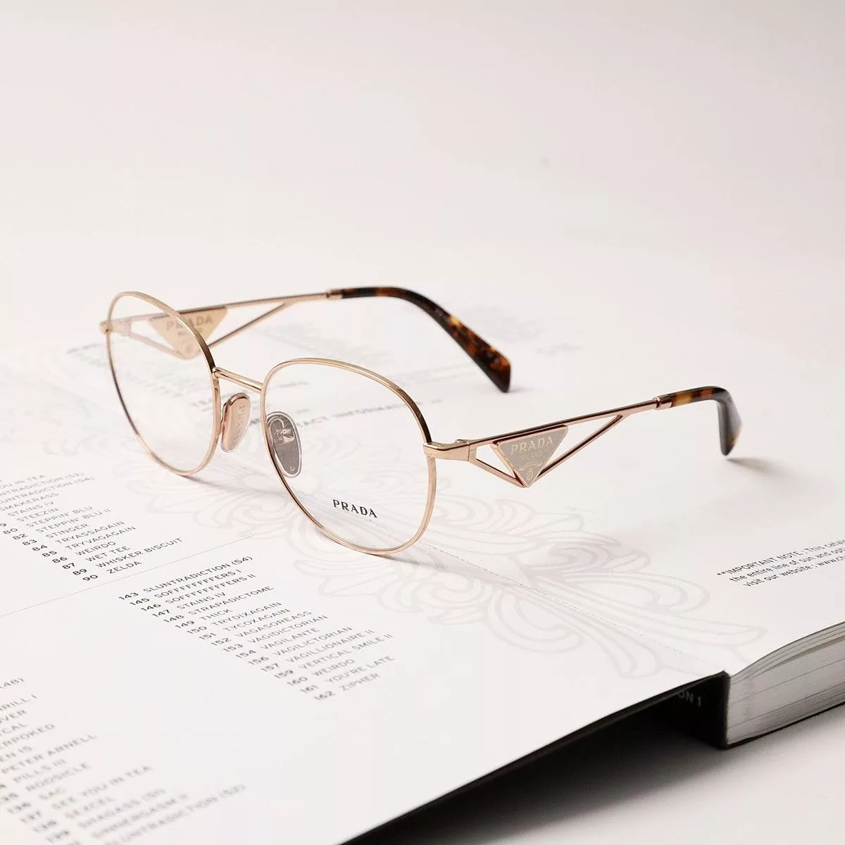 Prada Glasses PRADA 0PR A50V GLASSES Gold