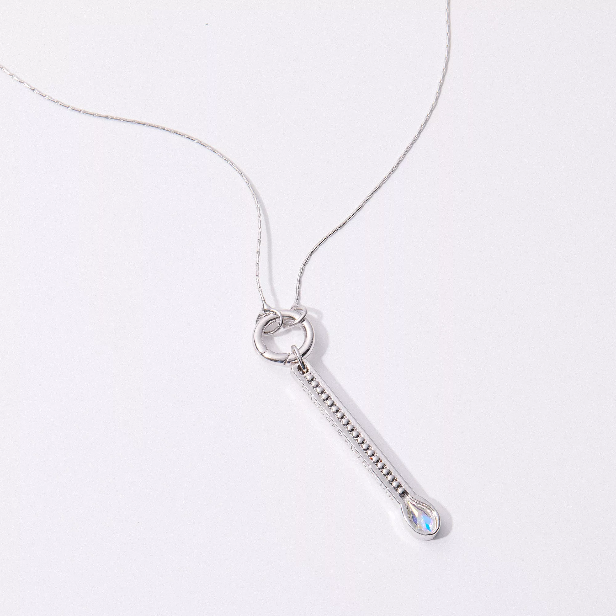 &LIVY Expandable Intention Chain Charm Necklace in finely finished silver with interlocking ring clasp and elongated bar charm pendant with gemstone accent on delicate silver chain