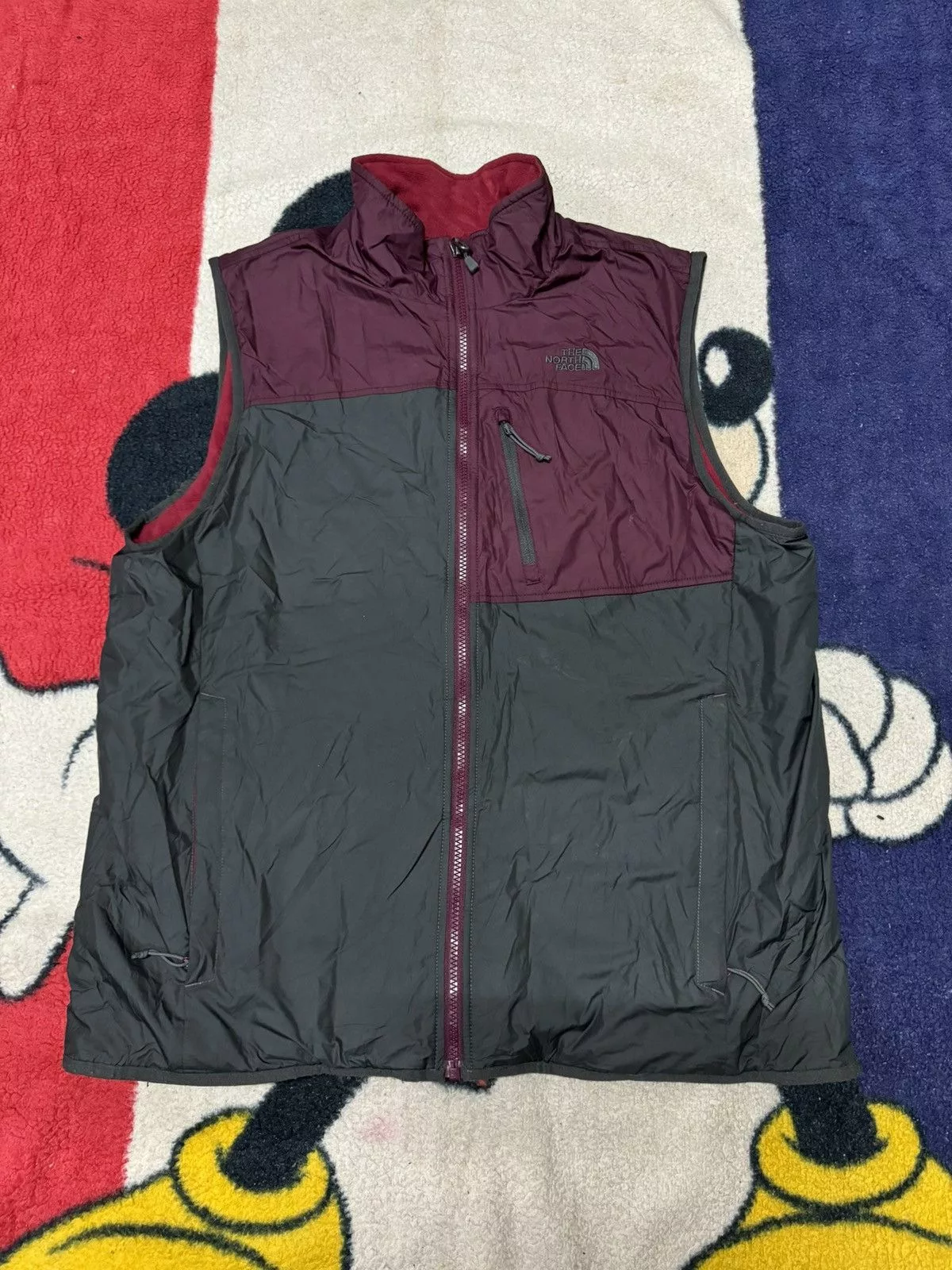 The North Face Vests THE NORTH FACE REVERSIBLE PUFFER VEST Red