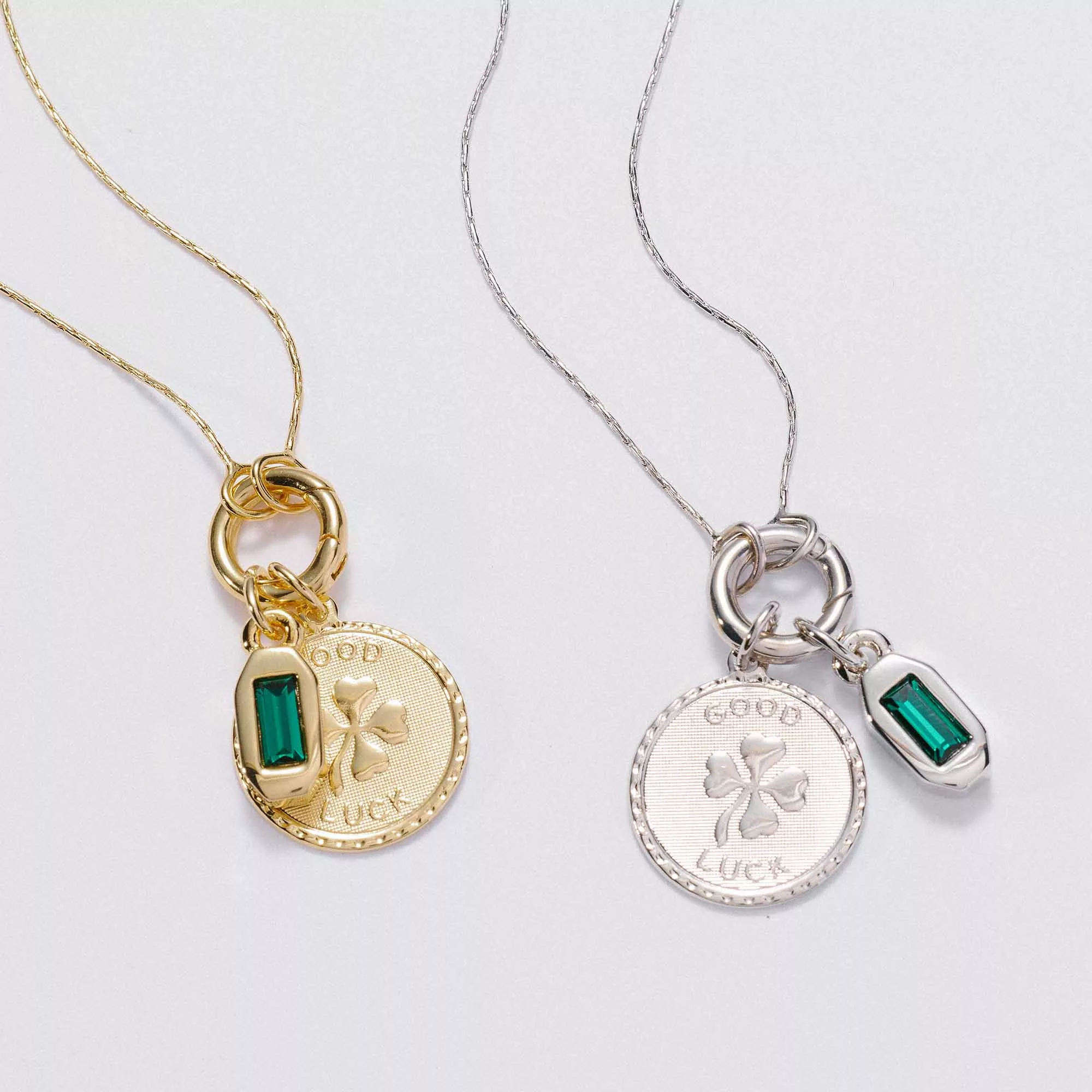 &LIVY Renewed Love Expandable Necklace Set in gold and silver with Good Luck Token Charm featuring four-leaf clover coin and emerald baguette crystal