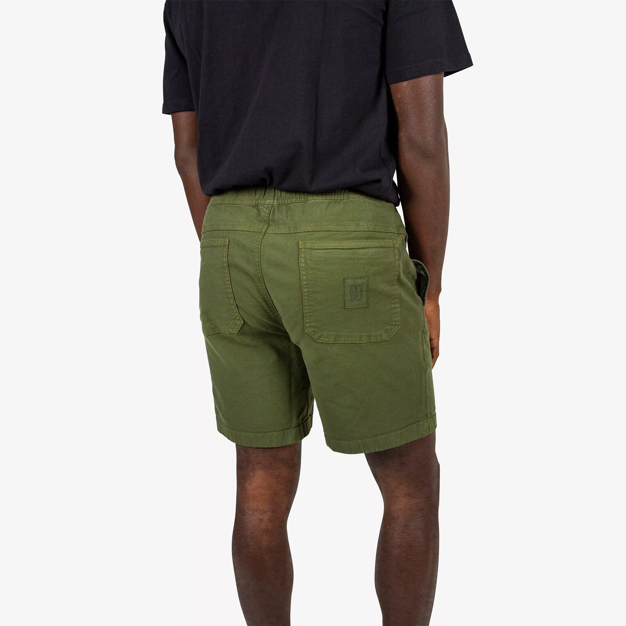 Back of Topo Designs Men's drawstring Dirt Shorts in Olive green on model.