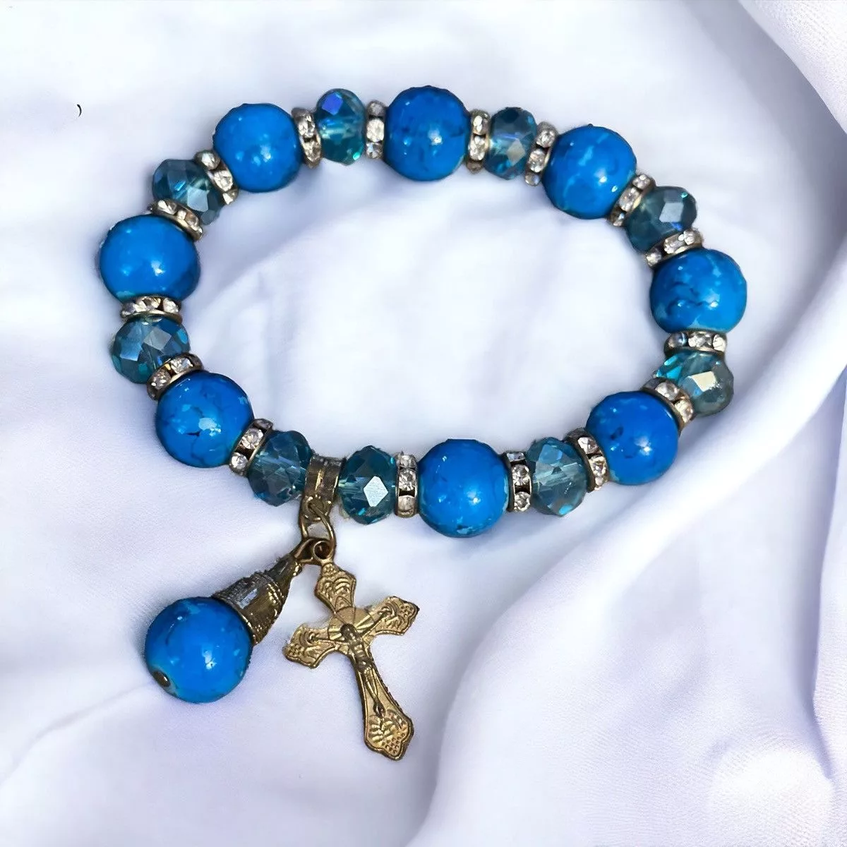 Other Bracelets Other Blue beaded stretch bracelet with cross charm