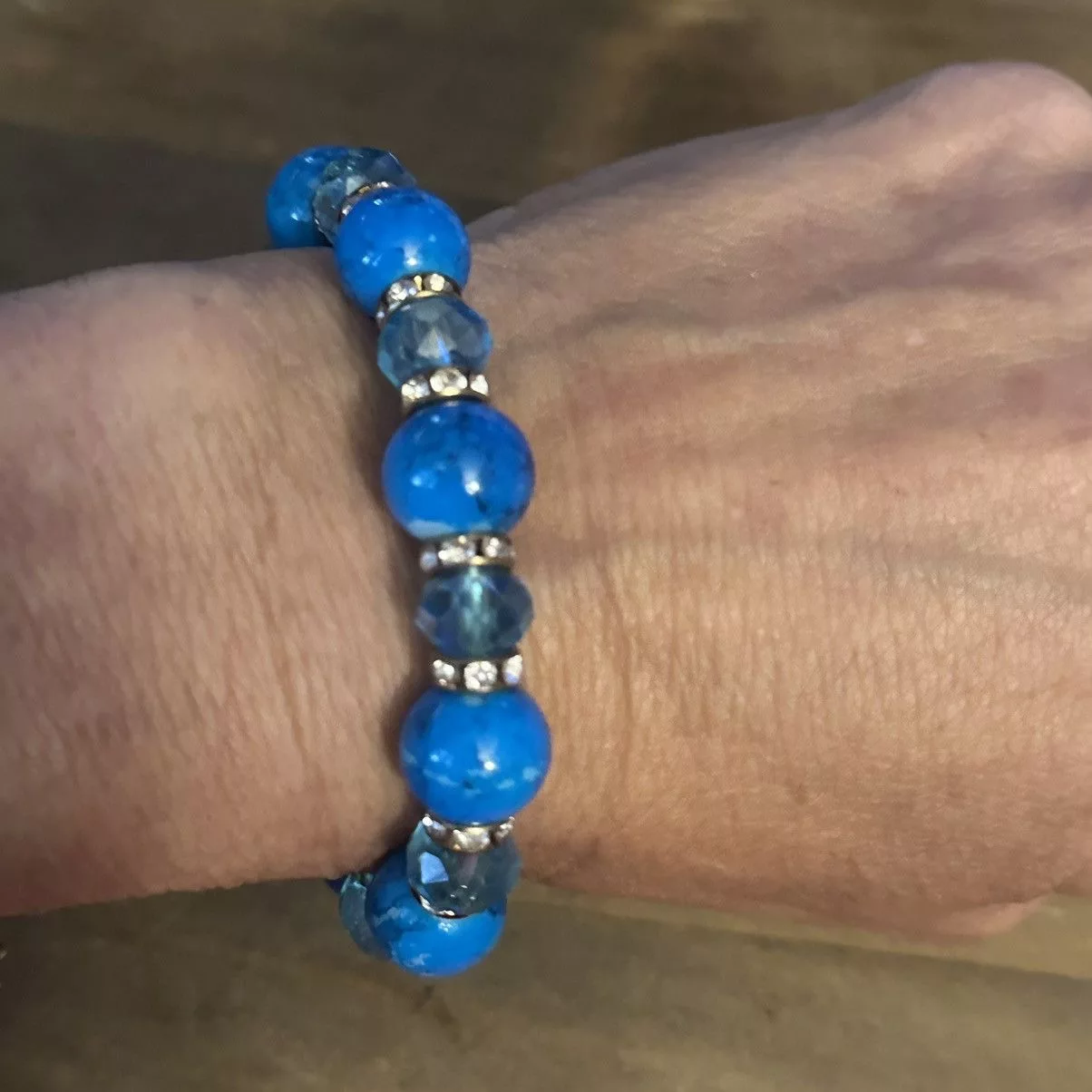 Other Bracelets Other Blue beaded stretch bracelet with cross charm