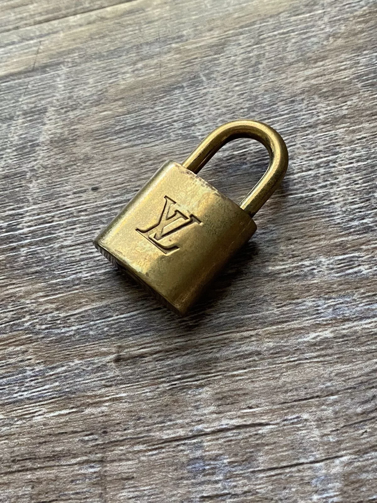 Louis Vuitton Miscellaneous Louis Vuitton Lock 332 Gold