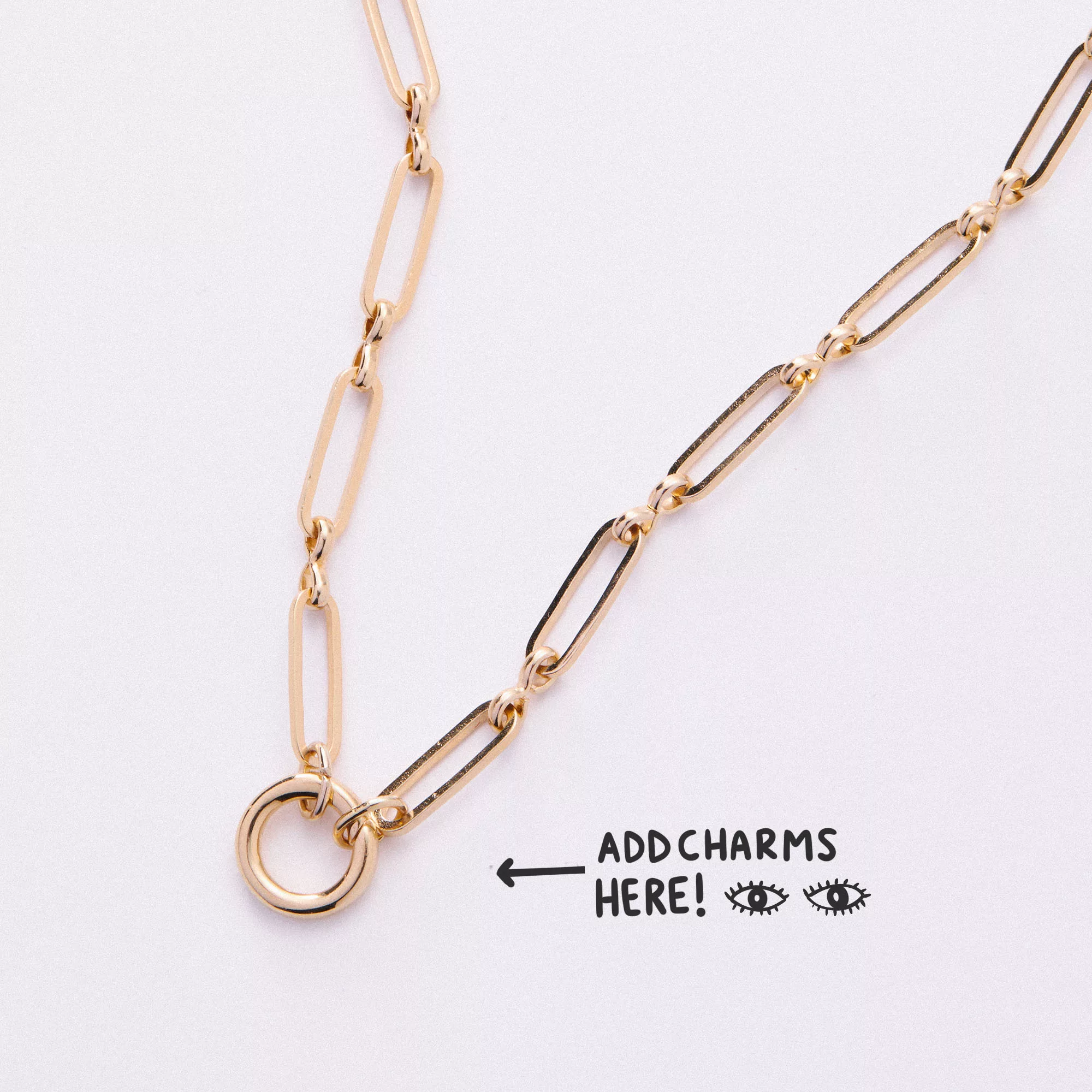 &LIVY Paperclip Intention Chain in finely finished gold showing paperclip links and round charm holder ring with text Add Charms Here and arrow pointing to charm holder