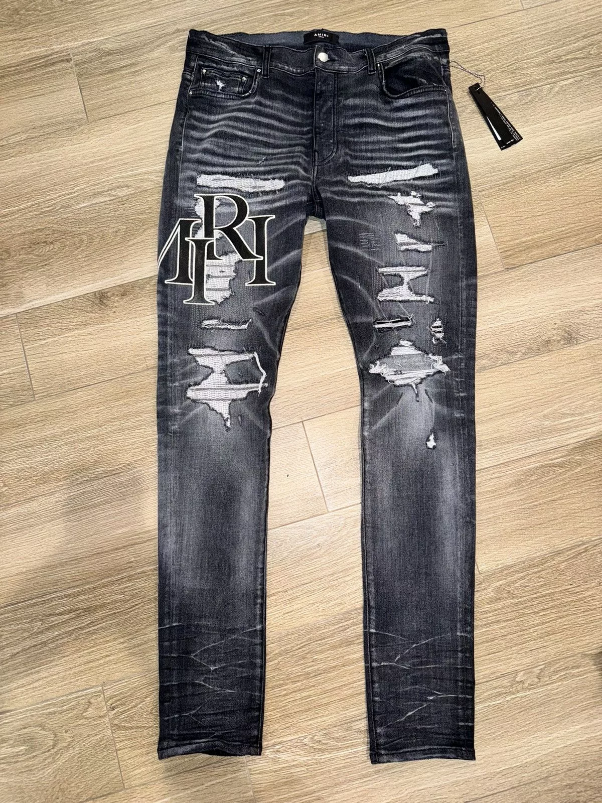 Amiri Denim AMIRI logo-print ripped skinny jeans Gray