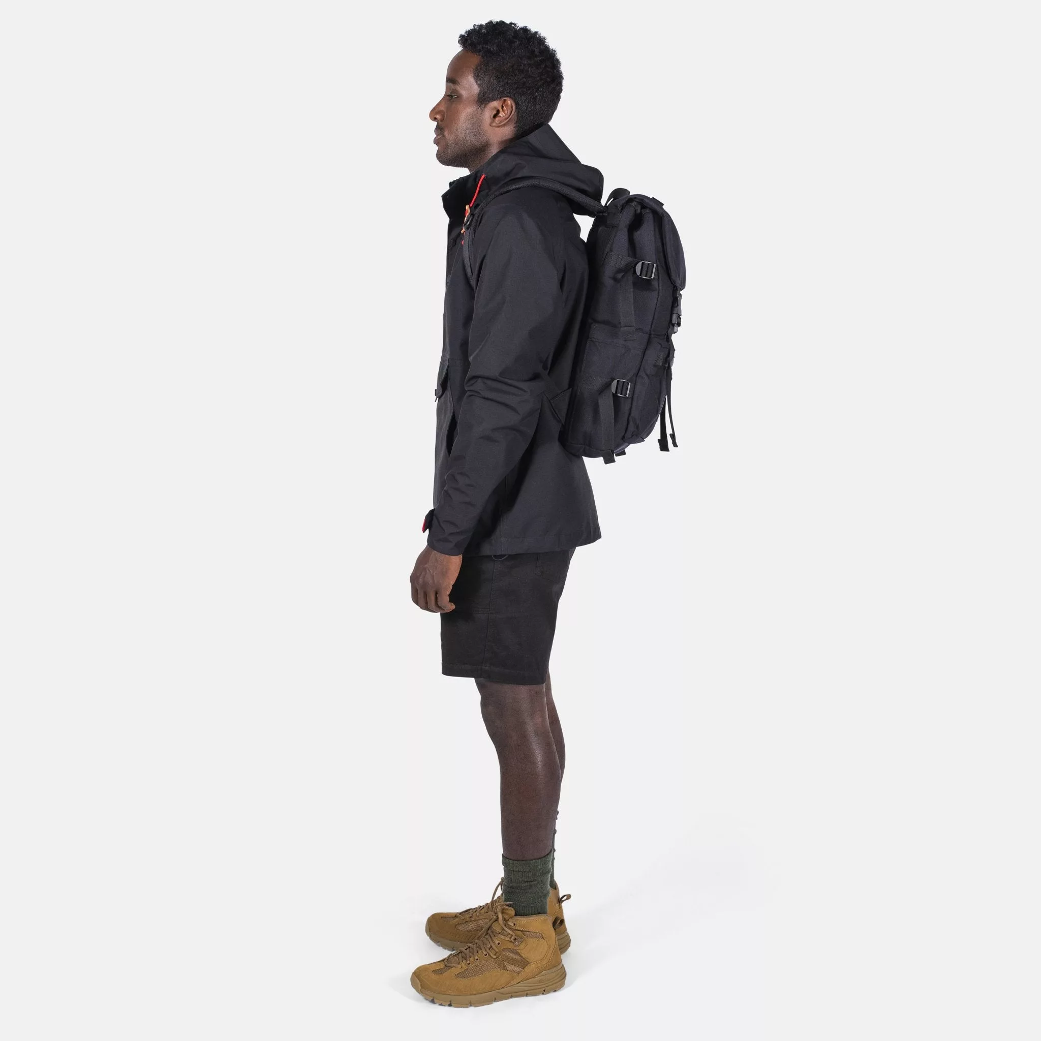 Side Model Shot of the Topo Designs Rover Pack Tech in Black