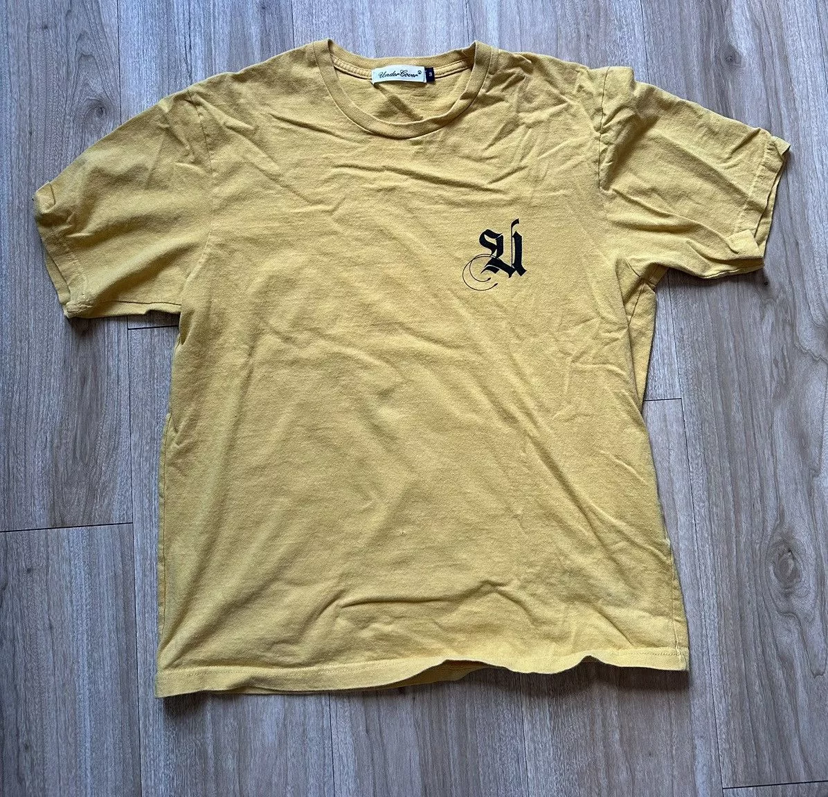 Undercover Short Sleeve T Shirts Undercover Yellow Gothic Text Tee